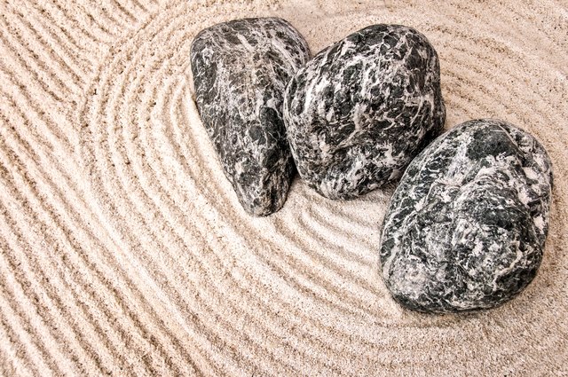 Zen gardens use sand and stones to create the illusion of water and land.