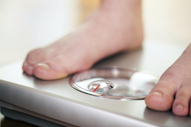 Feet on a bathroom scale.