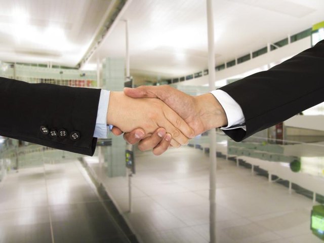 Businessmen shake hands. Businessmen shake hands.