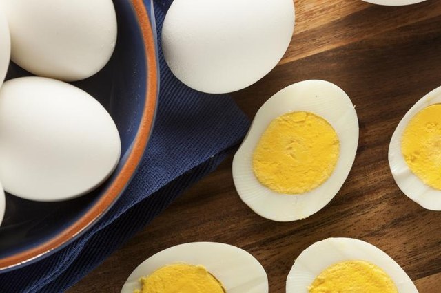 Hard boiled eggs on a wooden table.