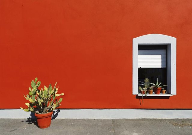 Exterior of an orange stucco house.