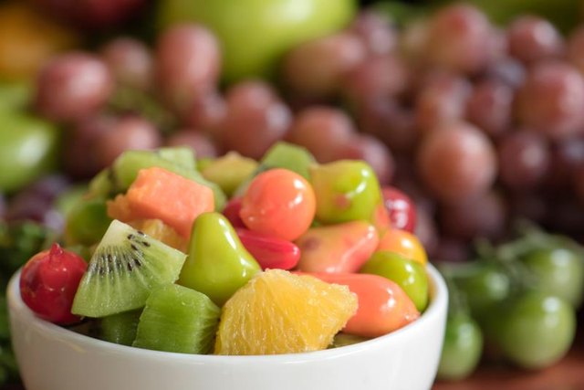 A bowl of sliced fruit.
