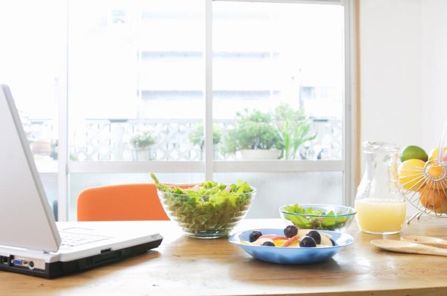 Healthy salads on a kitchen table.