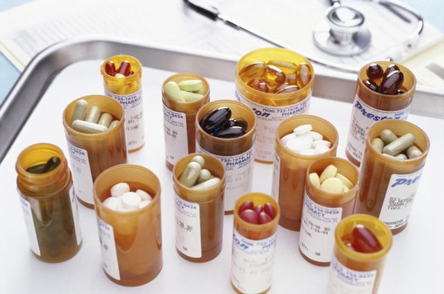 Assortment of supplements on hospital tray.