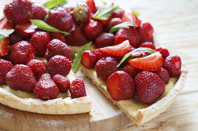 A tart made with fresh strawberries and mint.