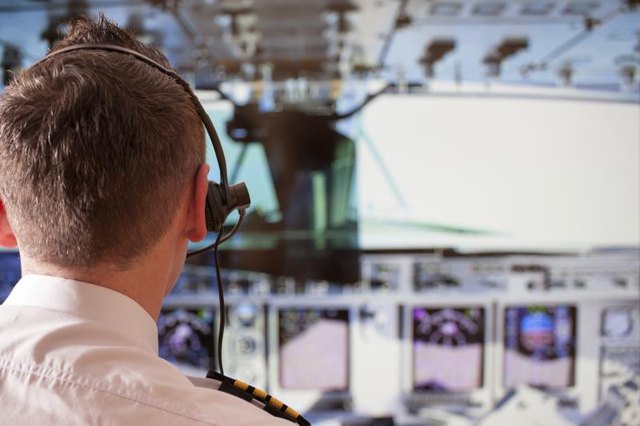 A flight instructor in a plane.