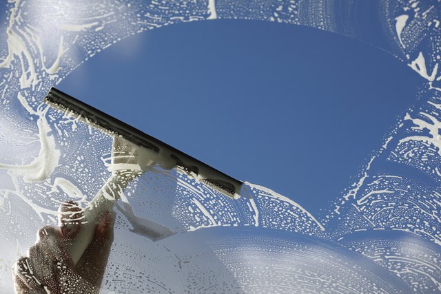 Use a broad, semi-circular stroke to clean large panes.