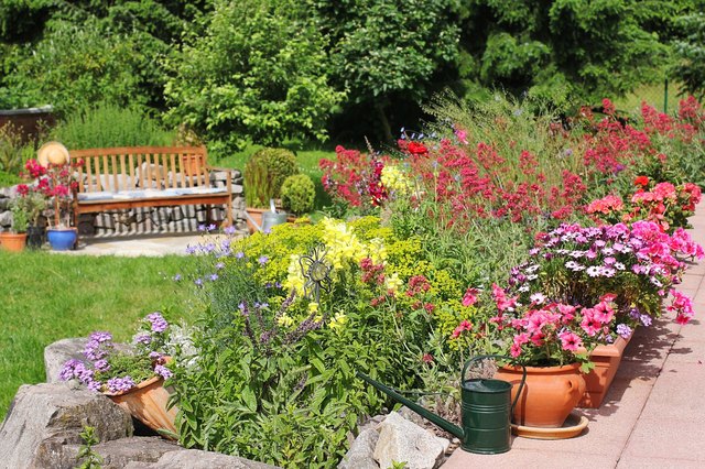 Lawn edging allows a rock garden and a lawn to grow well side by side.