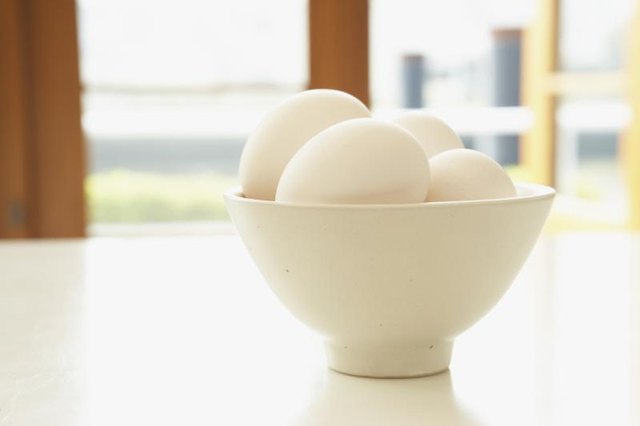 Small bowl filled with eggs.