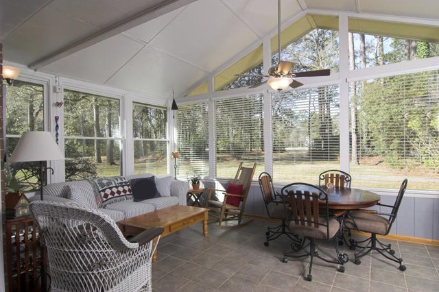 White beamed ceiling in sunroom