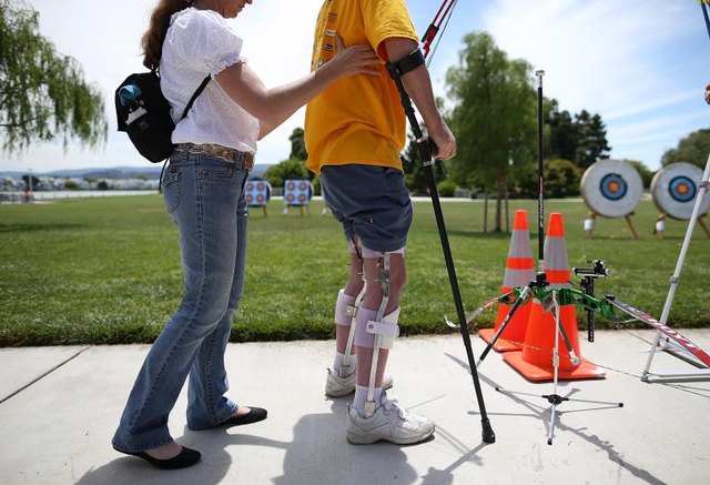 Disabled veteran participating in archery games