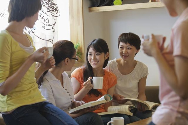 Five friends sitting at a coffee shop
