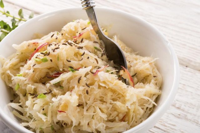 Sauerkraut with caraway seeds in bowl.