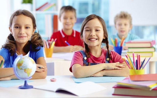 Happy preschool children in class.