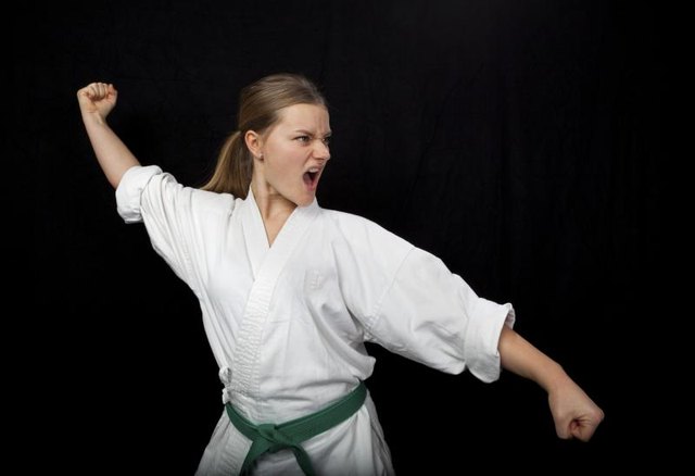 Martial artist with a green belt
