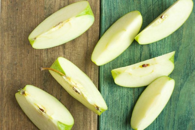 A sliced green apple.