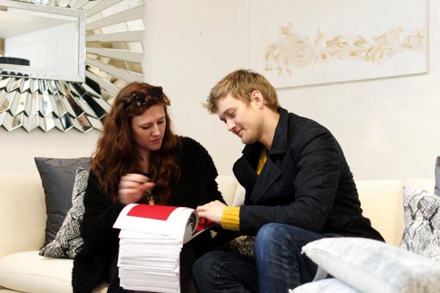 A young couple shopping in a furniture store.