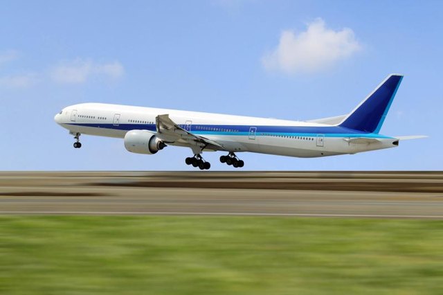 A commerical airplane landing on a runway