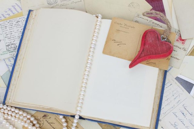 An overhead view of materials for a romantic scrapbook.