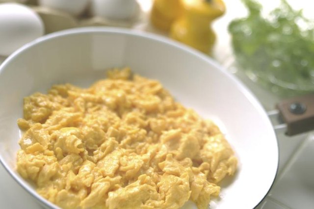 Close-up of scrambled eggs in bowl.