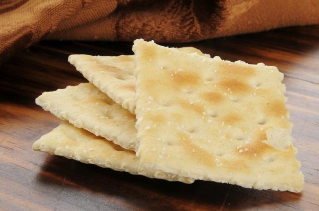 Saltine crackers on table.