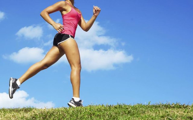 A woman is running outside.