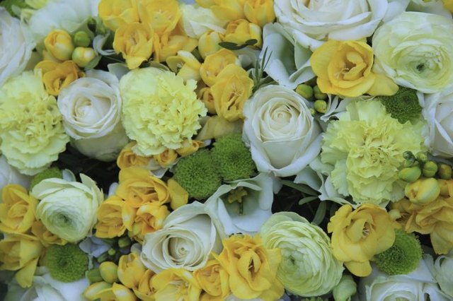 Golden freesias step in with sweet citrus scent among less fragrant florals.