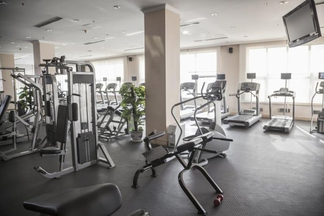 Large gym with exercise equipment.