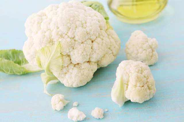 Cauliflower on a wood blue table.