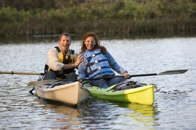 Couple kayaking on water.