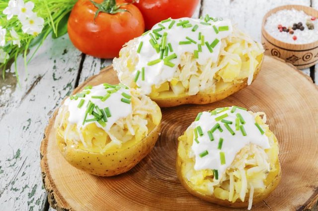 Potato skins with sour cream and green onions.