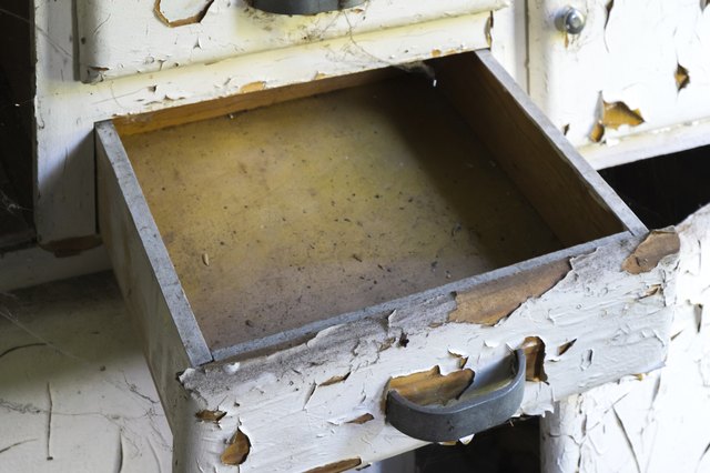 Old dresser drawers may be used as containers for vertical gardens.