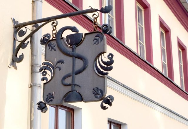A pharmacy's street sign. A pharmacy's street sign.