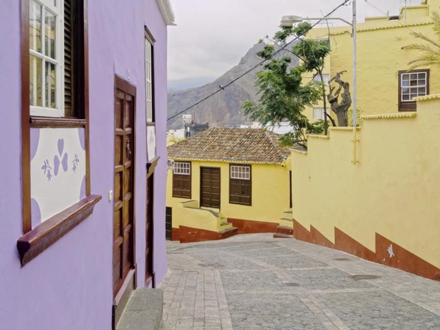 An alley between two colorful houses