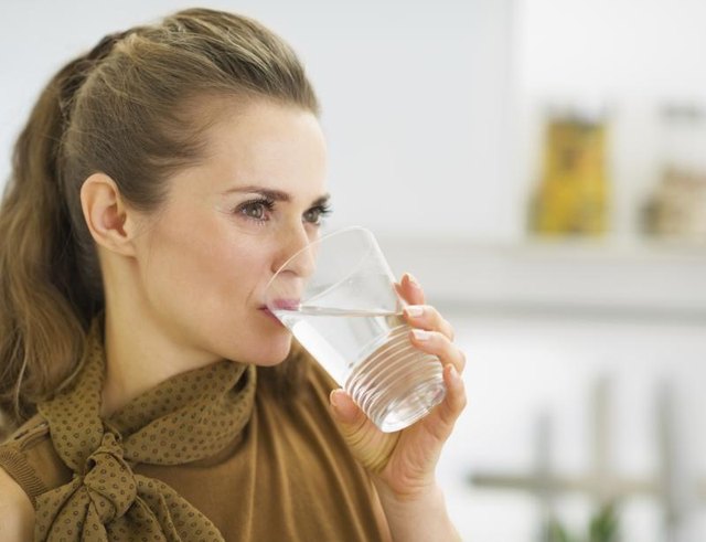 Woman drinking glass of water