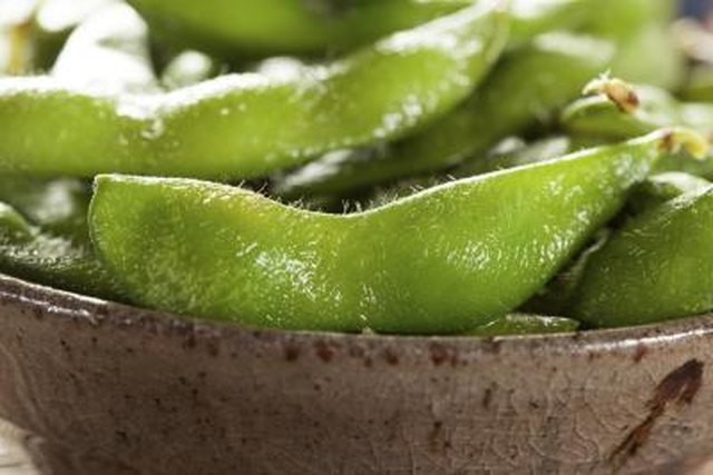 A close-up of salted edamame.