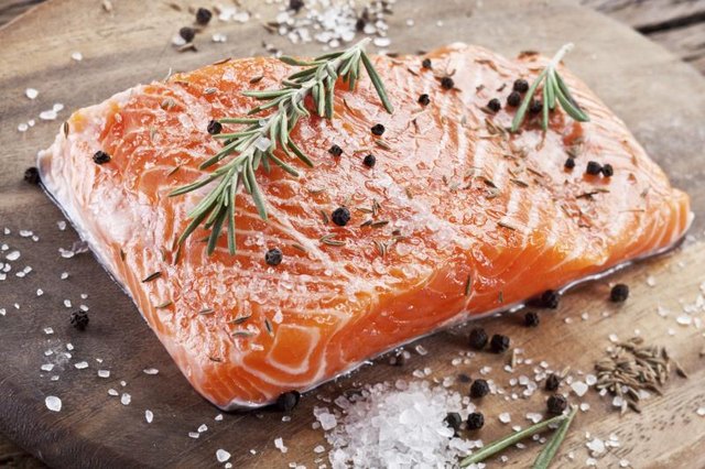 Fresh raw salmon with herbs and spices