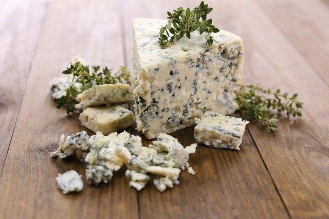 Crumbled blue cheese on table