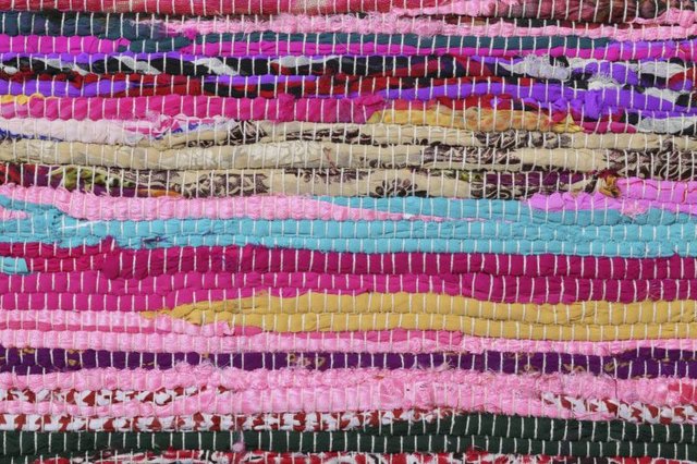 Close-up of a colorful braided rug.