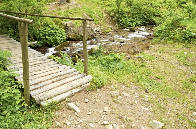 If you have the wood, paths made from rows of logs can last for decades.