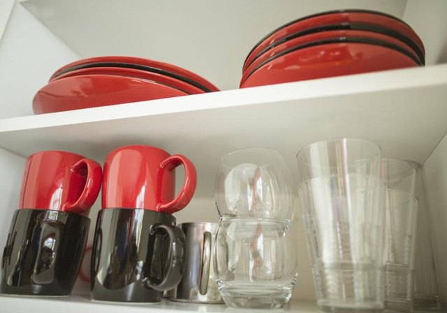 Dishes and glasses on kitchen shelf