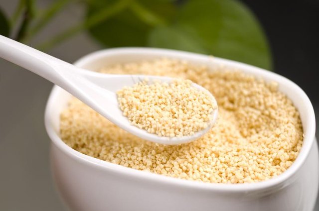 A container and spoon filled with soy lecithin.