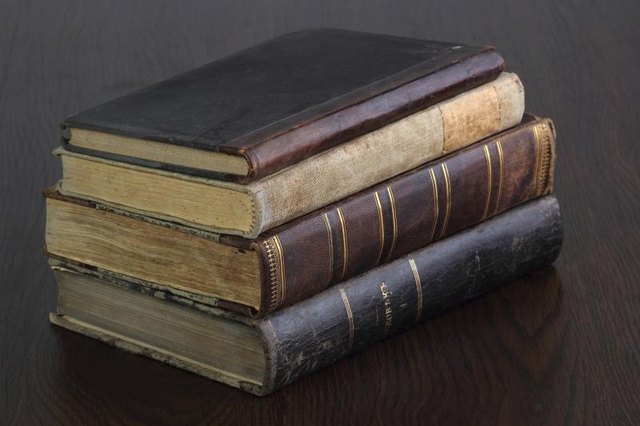 A stack of antique books.