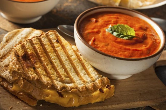 Grill cheese sandwich with tomato soup.