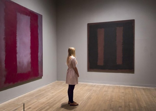 Woman looking at Rothko paintings