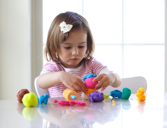 Girl playing with salt dough