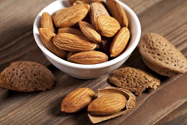 A bowl filled with almonds.