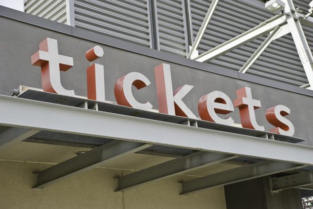 Tickets sign above a box office.