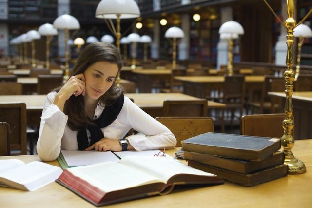 Student reading in library