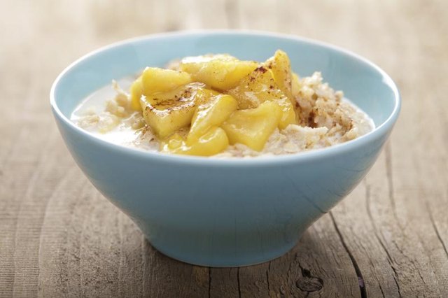 A bowl of oatmeal with caramelized apples.